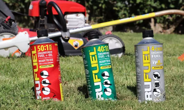 trufuel cans in front of trimmer mower