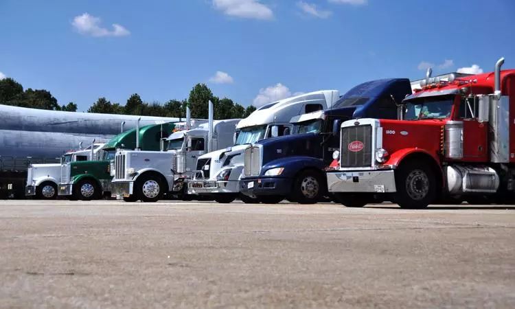 tractor trailer semi trucks lined up for loads