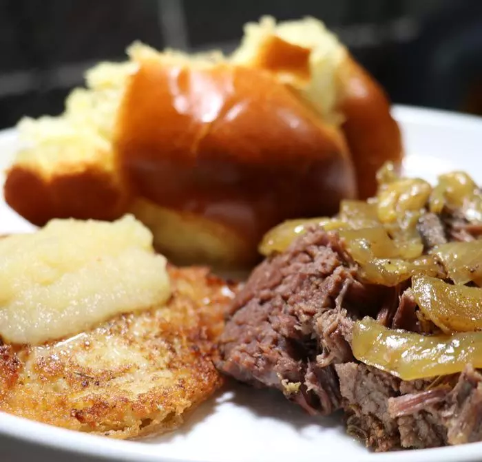 slow cooker beef brisket recipe with chollah bread and latkes
