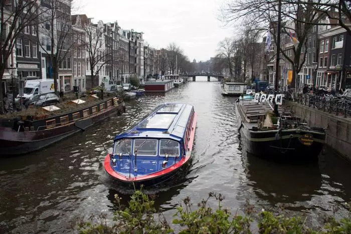 touring canals in amsterdam