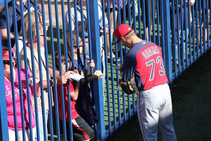 indians player signing autographs