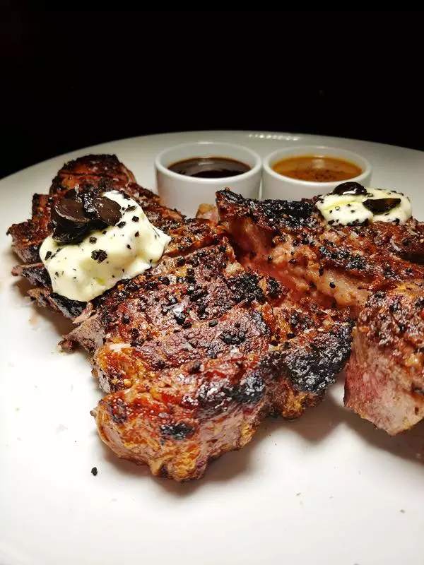 porterhouse steak with truffle butter at stk in san diego