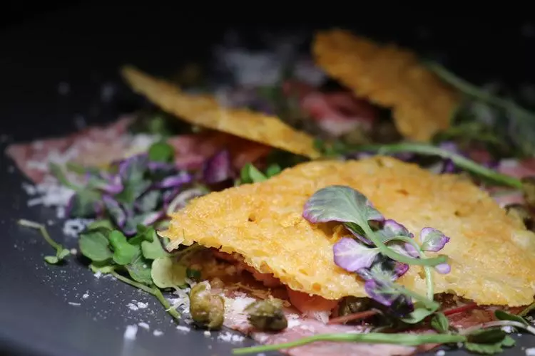 wagyu carpaccio with truffle parmesan crisp