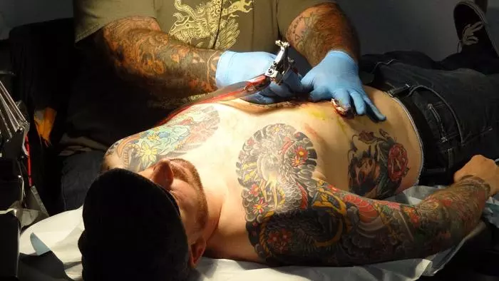 man getting tattooed