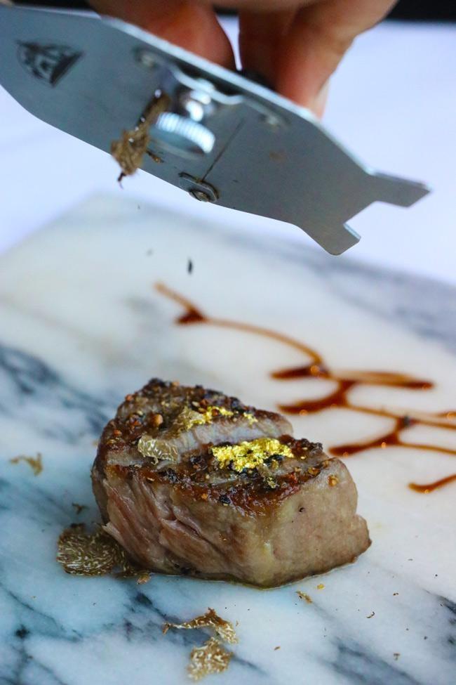 shaving truffles over wagyu