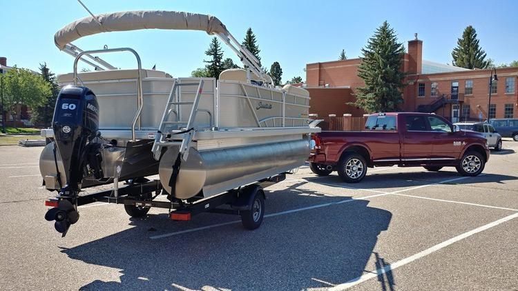 rear view of ram 2500 towing pontoon boat