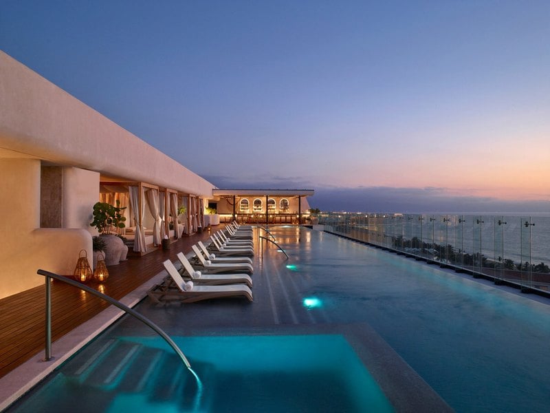 Rooftop infinity pool at dusk at UNICO 20 105 Riviera Nayarit