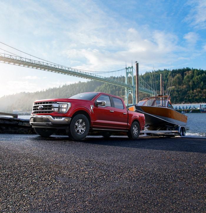all new ford f 150 truck towing a boat out of the water