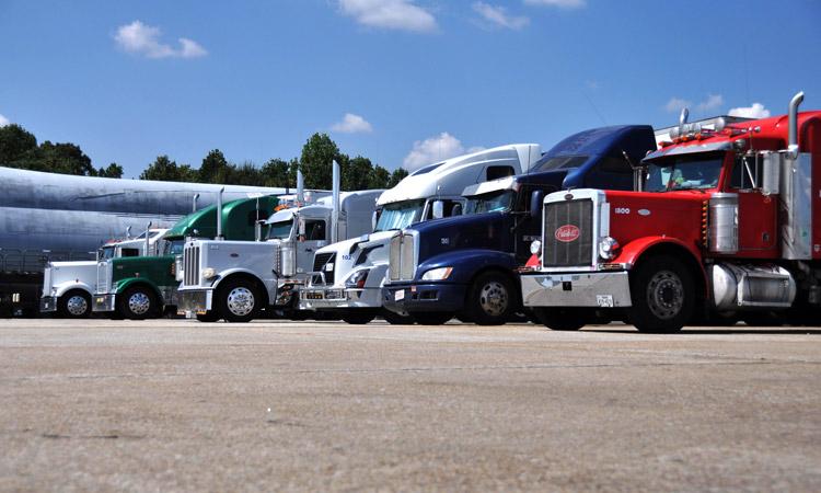 tractor trailer semi trucks lined up for loads