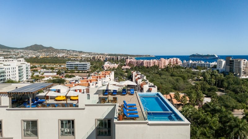 Rooftop pool deck overlooking downtown Cabo San Lucas at Kadun