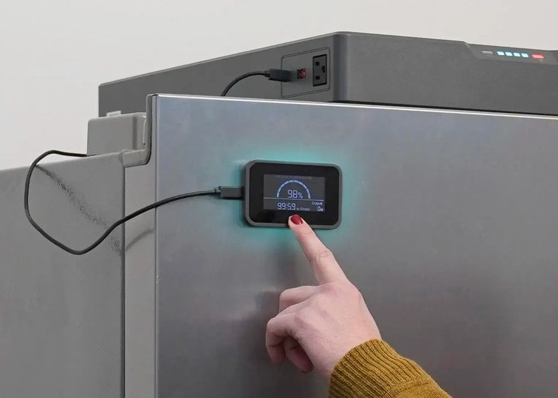 The Blackout Buddy magnetic remote display showing 98 percent battery and estimated runtime