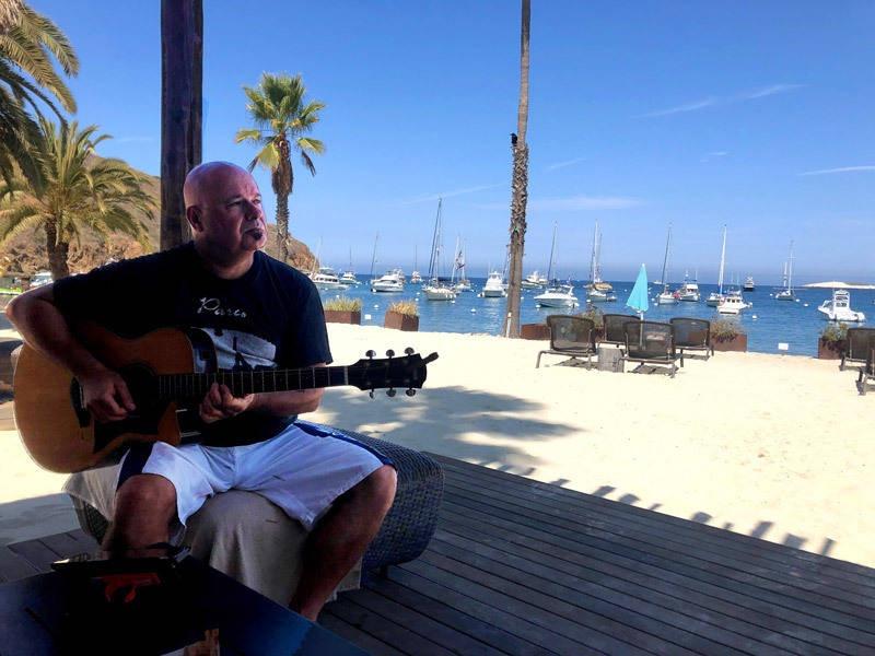 guitar playing in palapa catalina two harbors