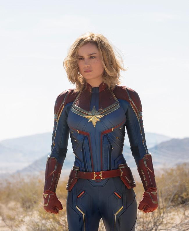 captain marvel in blue suit in desert