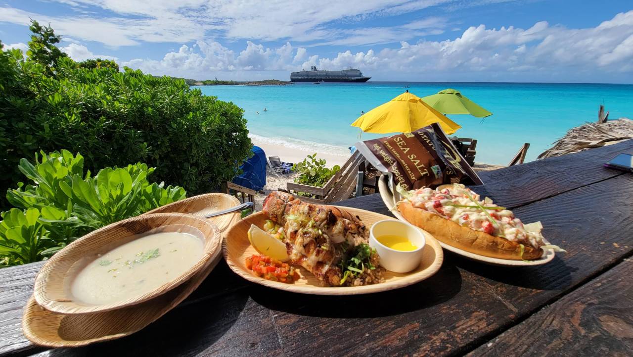 seafood shack lunch on beach at half moon cay the bahamas
