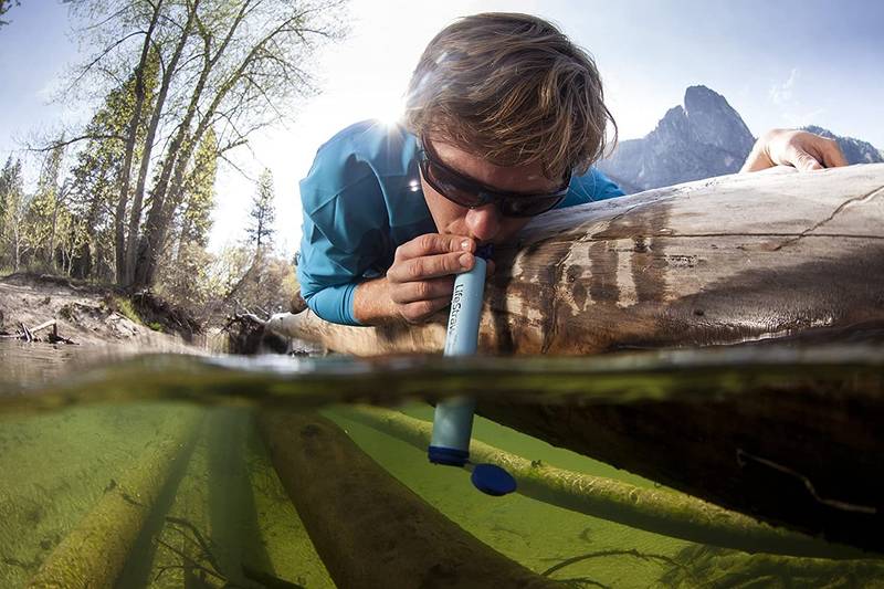 lifestraw drinking from a stream