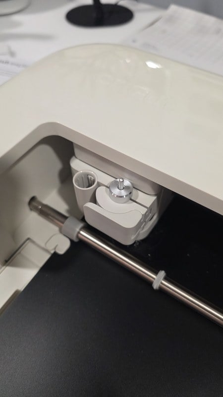 a close-up of the Cricut Explore 5 carriage and cutting bar