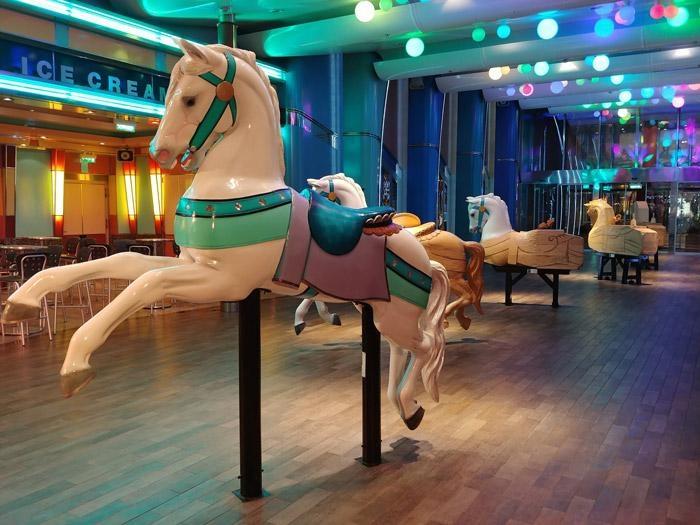 carved horses on boardwalk oasis of the seas