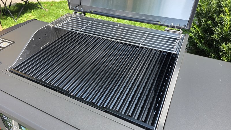 Open cook chamber on the Current Model G2 showing the black anodized aluminum grates and the stainless steel secondary rack above them