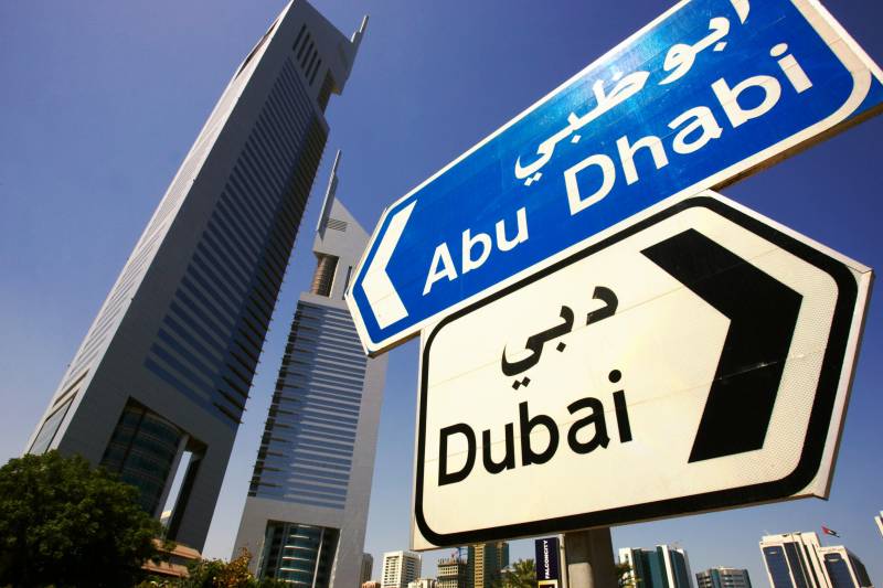 getting from dubai to abu dhabi street sign