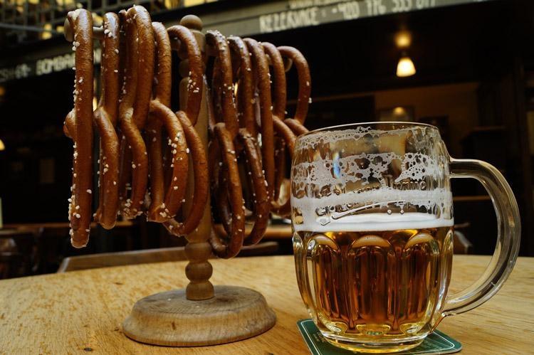enjoying czech beer and pretzels at bars in prague