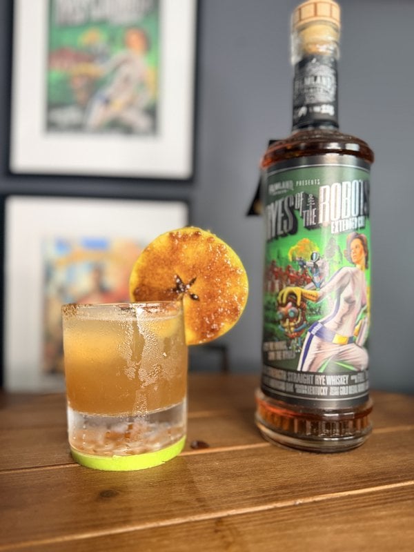 Caramelized Apple Rye Fest cocktail with a bottle of Filmland Spirits rye