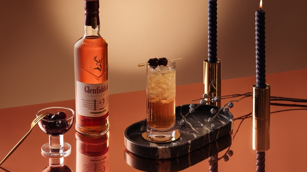 Glenfiddich Speyside Cobbler fall whiskey cocktail beside a bottle of Glenfiddich 12 Year Old Sherry Cask