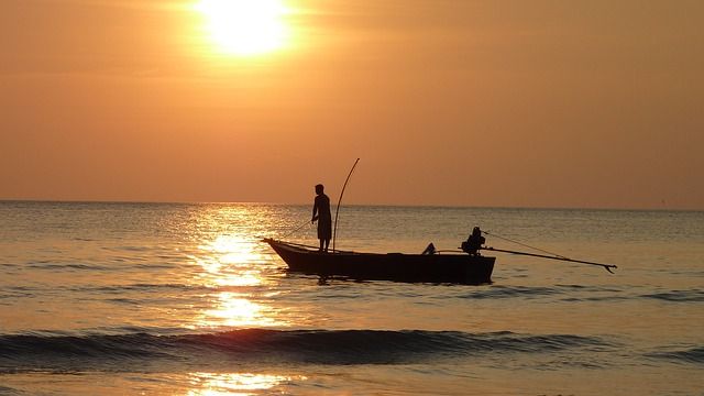 sunset boat fishing