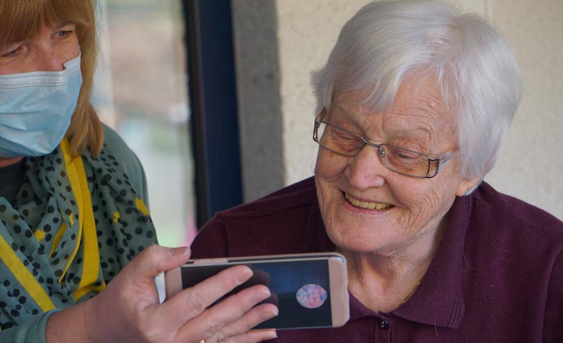 elderly woman watching live stream video