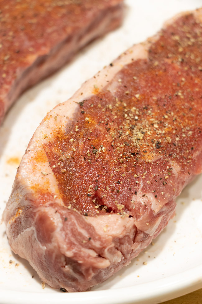 salt and pepper your steak before placing into the skillet