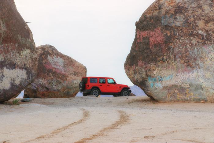 jeep wrangler surrounded by rocks