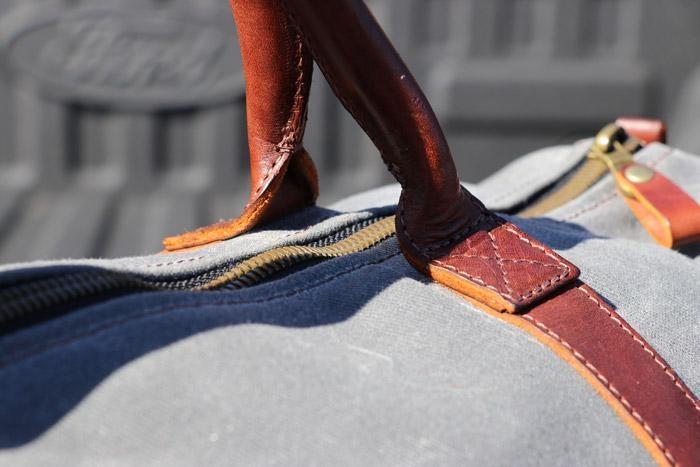 closeup on leather handles and stiching