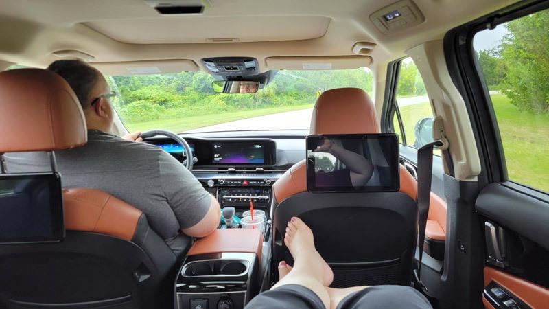 kia carnival heather relaxing in back