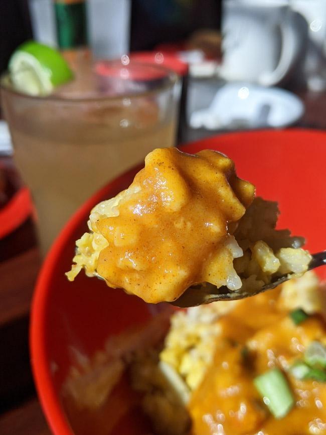 cajun swamp rice scrambled eggs mixed with rice topped with crawfish etouffee at buck and johnnys zydaco brunch