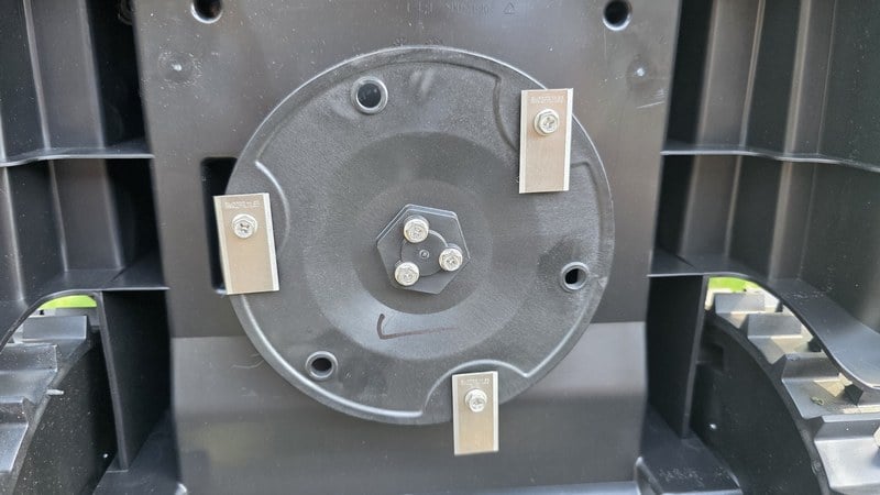 Underside of LawnMaster OcuMow R1600 cutting deck showing three pivoting razor blades on a rotating metal disc