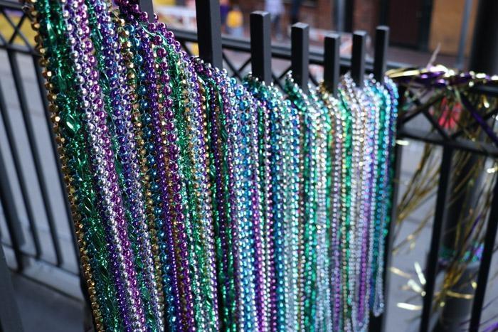 mardi gras beads on balcony