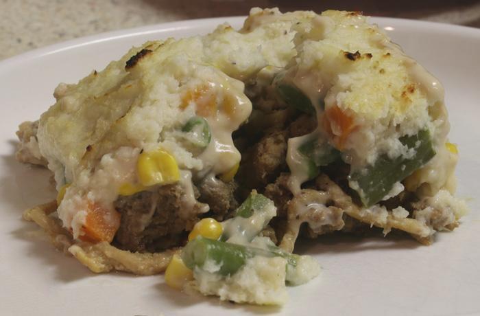 mashed cauliflower shepherds pie serving on white plate