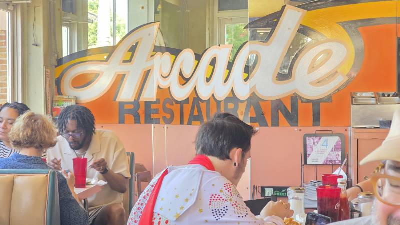 Elvis fan at Arcade Restaurant eating brunch in Memphis