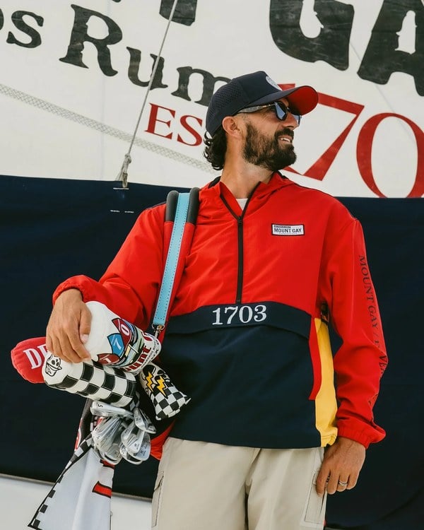 Mount Gay x Devereux Golf red sailing anorak with navy color blocking and 1703 chest embroidery