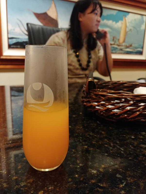 glass of juice at checkin outrigger reef waikiki beach