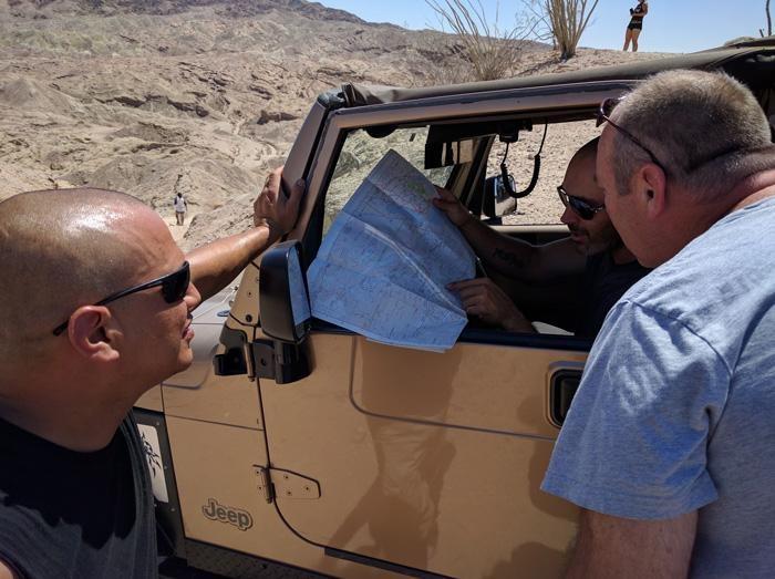 checking a paper map for directions