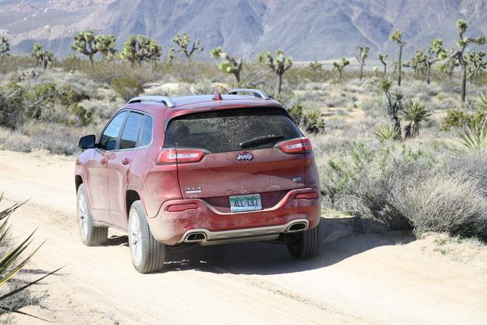 rear of jeep cherokee overland on geology trail in joshua tree national park california