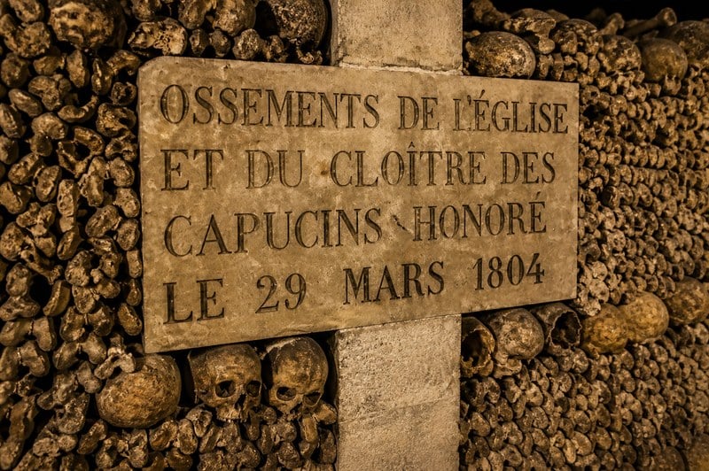 1804 marble plaque marking bones from the church and cloister of the Capucins-Honoré, transferred to the Paris Catacombs on March 29, 1804