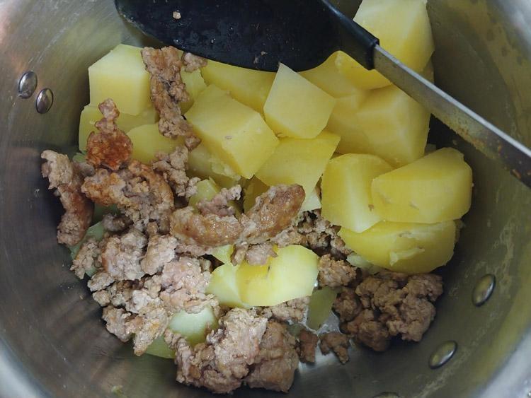 pork and potatos mixed in pan