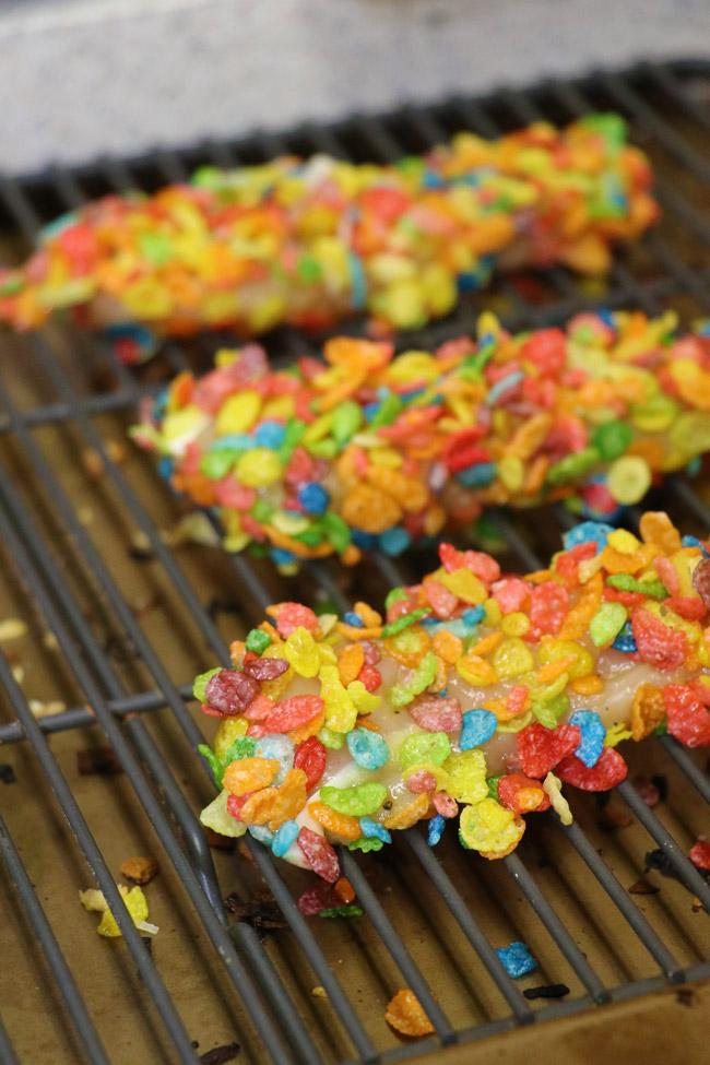 uncooked crunchy rainbow chicken tenders on baking rack