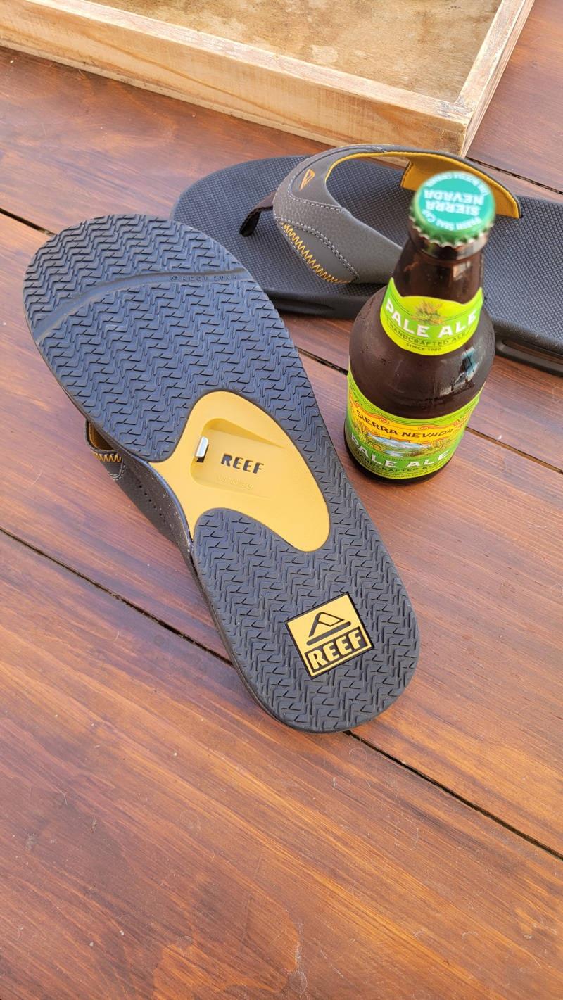 reef flip flops with beer bottle