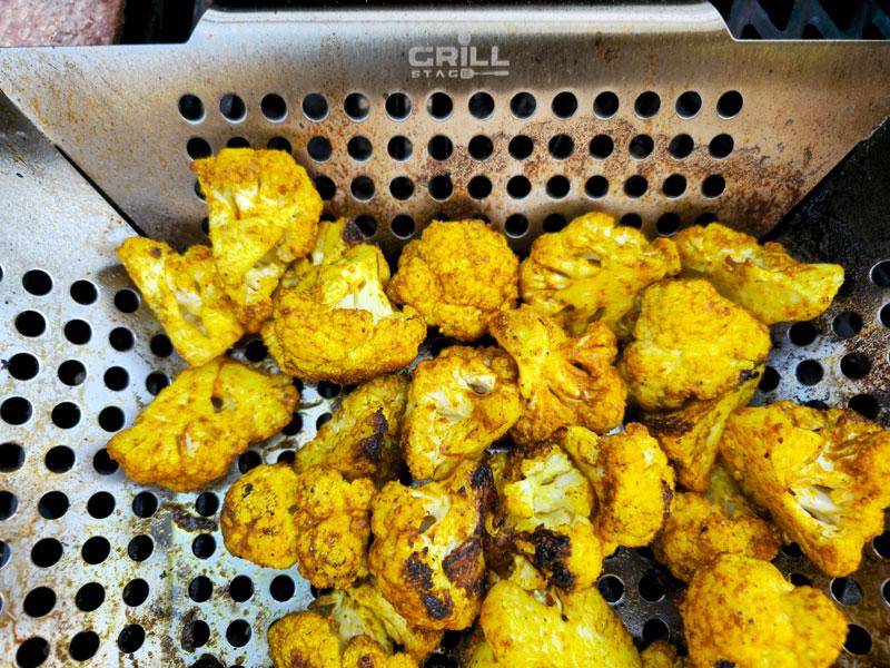 curry grilled cauliflower in grill basket