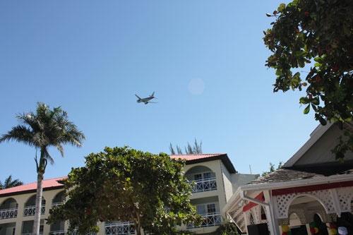 plane-flying-over-hotel