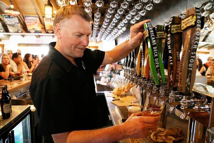 david esdaile pouring in los olivos tasting room of figueroa mountain brewing