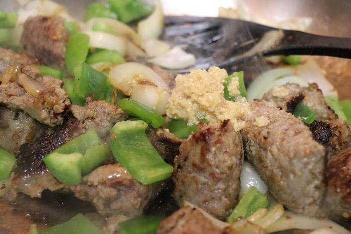 sautee onions peppers sausage