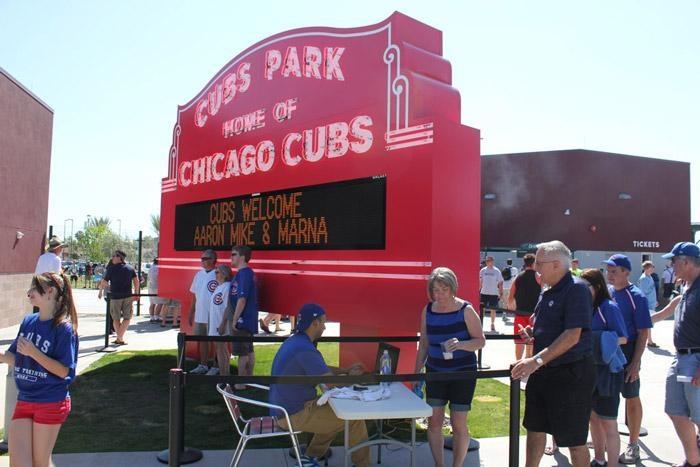 photos in front of Cubs Park - Wrigley Field sign in Mesa Arizona
